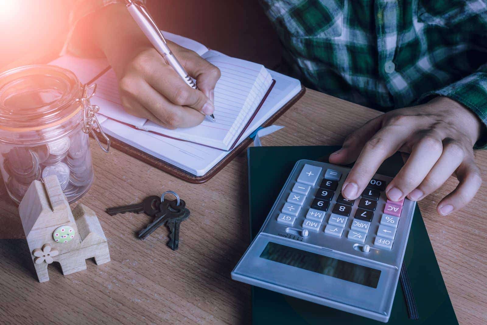 Borrower reviewing loan-to-value ratio and mortgage financing calculations
